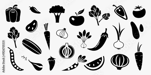Collection of black silhouette icons depicting various fruits and vegetables