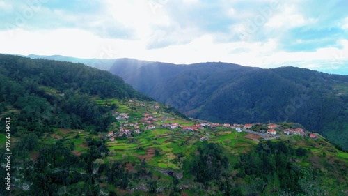 Hillside Village Surrounded by Forests and Mountains
