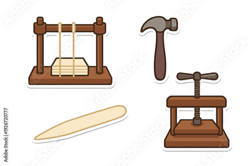 Traditional bookbinding tools set including press, hammer, and bone folder