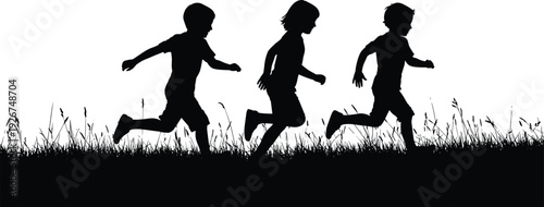 Three children running in silhouette on grass kids black
