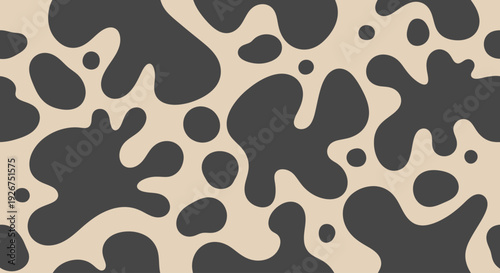 Seamless cow print pattern with dark organic spots on beige background.