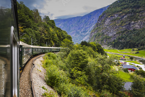 Slika na platnu Spectacular view from the famous Norwegian Flåm train speeding uphill on its way to Myrdal station