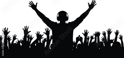 Silhouette of DJ with headphones raising arms over cheering crowd at live music concert party event with hands up in celebration energetic nightlife atmosphere