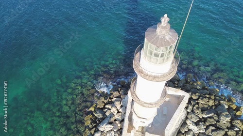 bay of Chania with sea and lighthouse at sunny summer sunset, Crete, Greece,