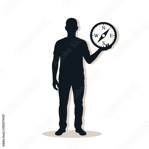 Silhouette of a person holding a compass, symbolizing direction and navigation