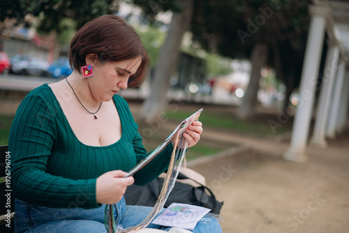 Photos Woman embroidering threads outside, enjoying hobby and craft