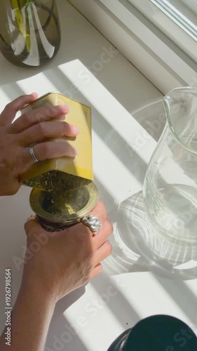 Hands of a woman preparing mate drink