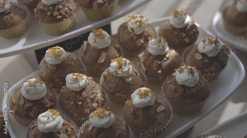 Wallpaper Mural Delicious muffins with cream and sprinkles arranged on a platter Torontodigital.ca