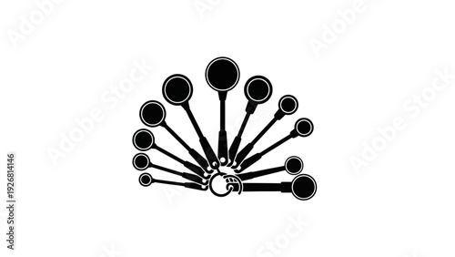Set of black measuring spoons arranged in a circular pattern.