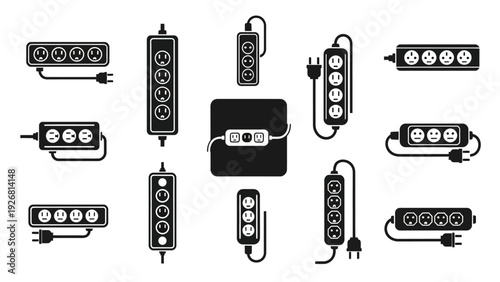 Collection of various black and white LED strip lights and power adapters.