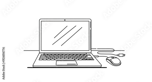 Laptop Computer with Mouse and Cable on a Desk, Ready for Work.
