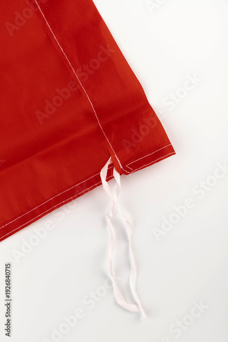 Seams on nylon fabric with stitches. Synthetic fabric texture. Macro detail.