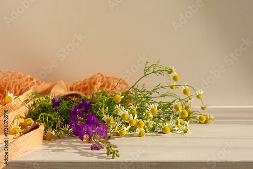 Wallpaper Mural A bouquet of daisies on the table. White and purple flowers in vintage style. Delphinium and field daisies on a wooden table. The copy space. A soft warm background. Mother's Day greeting card concept Torontodigital.ca