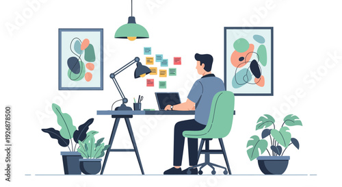 Man working on laptop at desk in modern office.