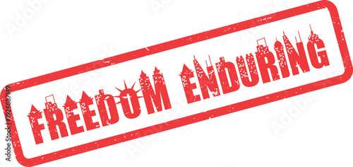 Grungy red rectangular stamp displaying the words Freedom Enduring with a city view