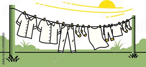Clothes drying on a clothesline in the bright sunshine with green grass and a gentle breeze