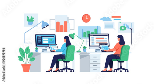 Two women working at computers in an office setting.