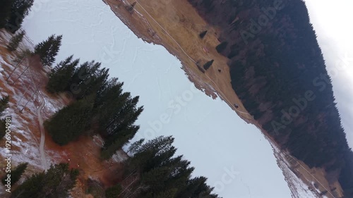 Winter aerial of the iconic Geroldsee in Kruen Germany. The Wagenbruchsee is a popular alpine destination. Snowy mountain landscape in the Garmisch-Partenkirchen district.