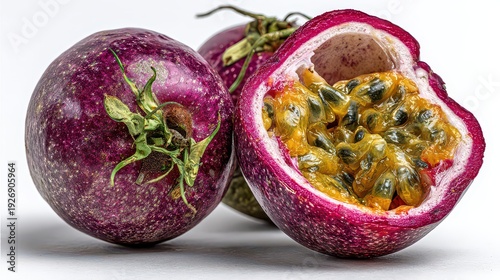 Fresh Passion Fruits in Vivid Purple Hue and Yellow Seeds on White Background with Dramatic Lighting for Food and Tropical Theme