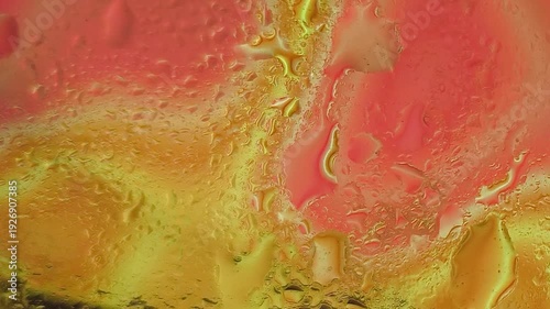 Vibrant abstract background with swirling patterns of red, yellow, and orange hues, featuring textured, molten-like effects with a mix of smooth and rough surfaces.