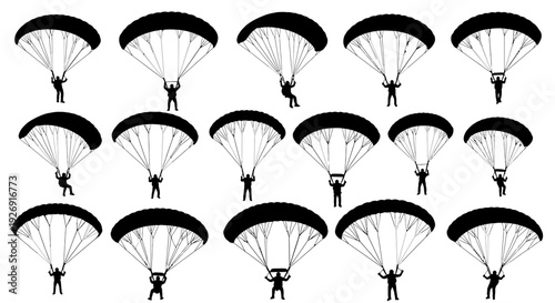 Multiple skydivers descending with parachutes in formation.