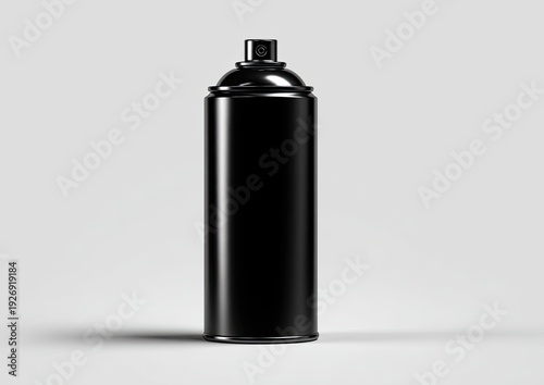 A close-up studio shot presents a sleek, black aerosol spray can against a plain background