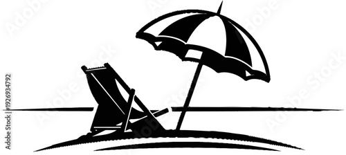 Silhouette of a beach chair and umbrella on a sandy shore