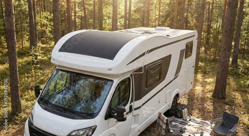 Flexible solar panel mounted on the roof of a modern camper van parked in a sunlit forest clearing for off-grid camping adventure