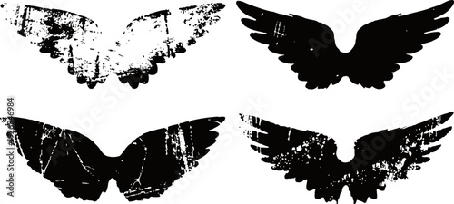 set of black grunge wings silhouettes distressed angel feathered wing shapes with rough texture and worn edges