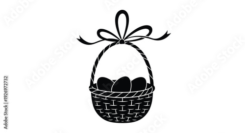 Wicker basket featuring three dark eggs is adorned with a simple ribbon bow at the top.