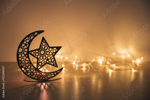 Islamic ornament and glowing string lights symbolizing religious celebration