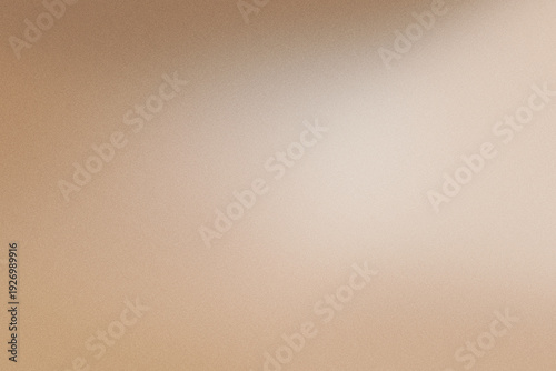 Soft beige brown background showing blurry gradient with delicate texture and warm light
