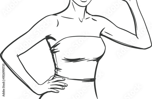 A woman in a strapless top with her hand on her hip and arm raised