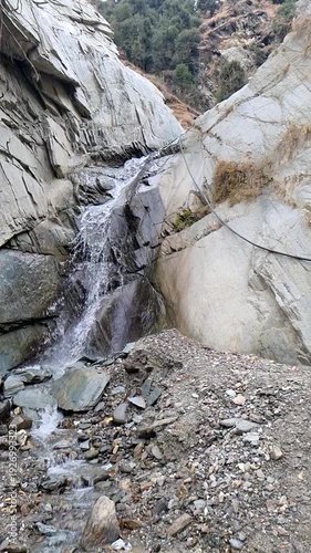 Hidden Rocky Waterfall in Mountain Valley, Slow Motion Water Moving 
