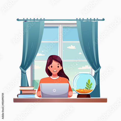 Young woman working on a laptop by the window with a fishbowl