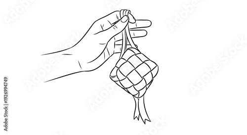 Hand holding a woven rattan or bamboo ball decoration