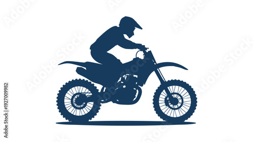 Silhouette of a person riding a dirt bike through a scenic trail