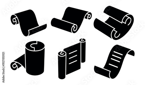 Collection of various black rolled up papers and sheets in different positions and shapes on a plain white surface