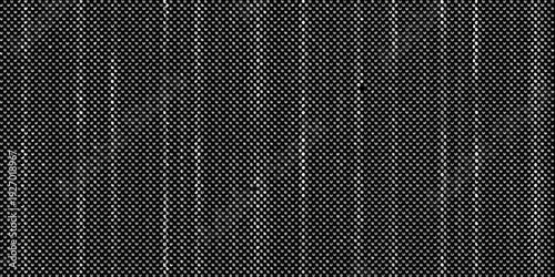 Close up of a dark textured fabric with a subtle vertical stripe pattern