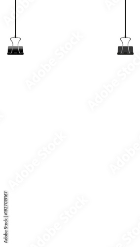 Two black binder clips suspended from a black background, holding a white sheet of paper