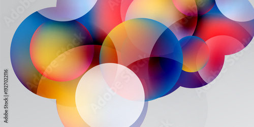 Abstract colorful circles overlap, creating vibrant gradients. Soft hues blend into dark background. Modern design element.