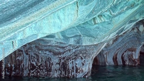 Glimpse the breathtaking beauty of Marble Caves in Patagonia. Observe the stunning azure and white marble formations, carved by nature's gentle hand.