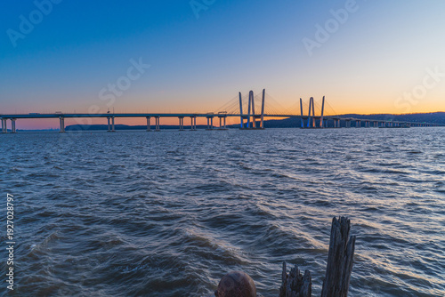 dramatic sunset view of the Tappan Zee Bridge spanning the Hudson River in Tarrytown, New York
