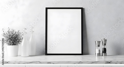 Blank Picture Frame on Marble Countertop with Plant and Salt Pepper Shakers.