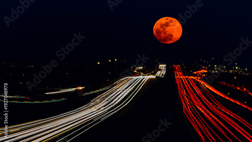 night traffic in the city with moon