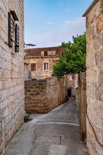 Croatia, Vis Island, street and old Dalmatian houses on a sunny summer day. The historic town of Vis on the island of Vis.