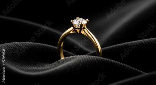 Elegant Gold Ring with Diamond on Black Satin Background