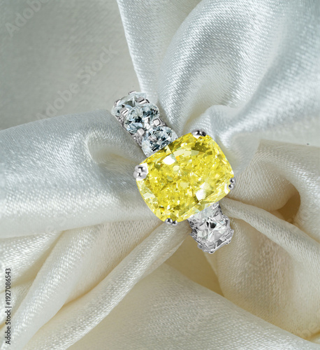 Luxury Yellow Diamond Ring on Silk Fabric Background Close Up