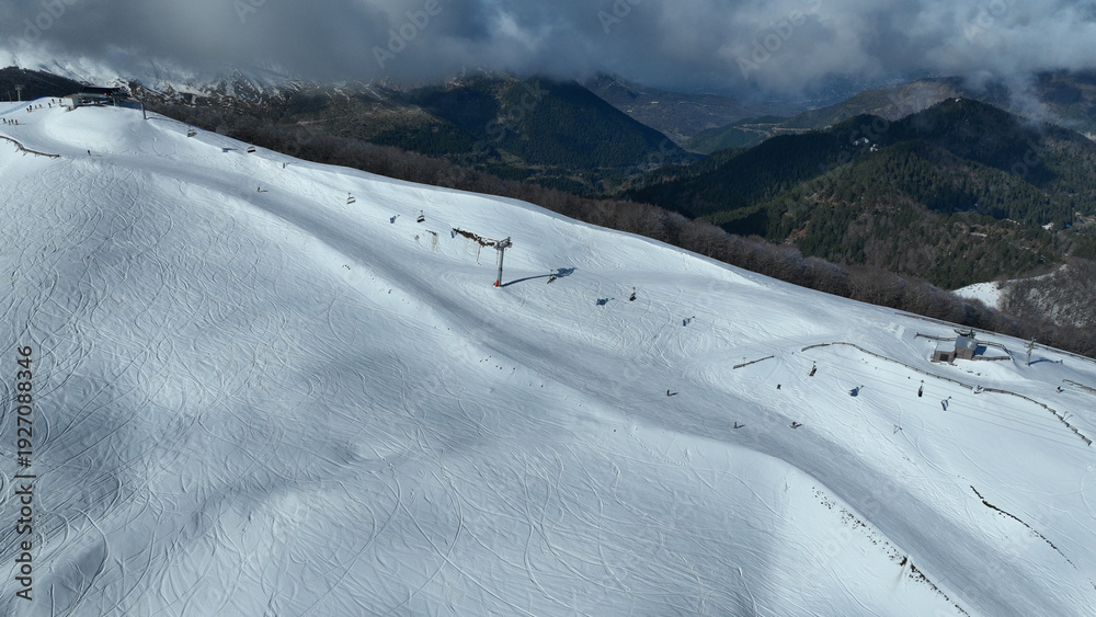 Obraz premium Aerial drone of recently renovated snow center of Anilio Perched on the top of Pindus, with the comparative advantage of easy and direct access via the Egnatia Motorway, covered in snow, Epirus, Greec
