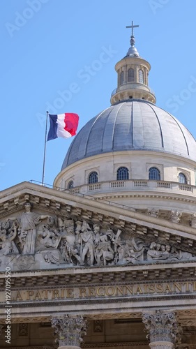Classic architecture of the Pantheon in Paris with detailed sculptures and French flag above the dome. Iconic landmark image ideal for travel, culture, history and European tourism concepts
